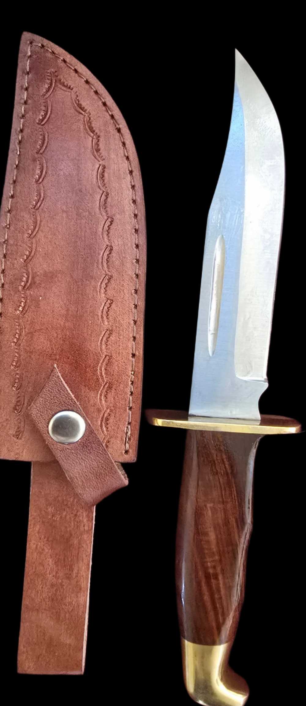 Stainless steel hunting knife with tooled leather sheath -img-0