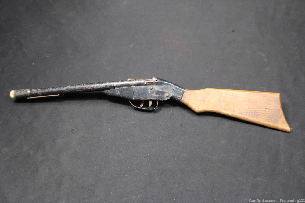 An Antique Wyandotte Brand All Metal Products a Toy Two Barrel Cork Gun-img-0