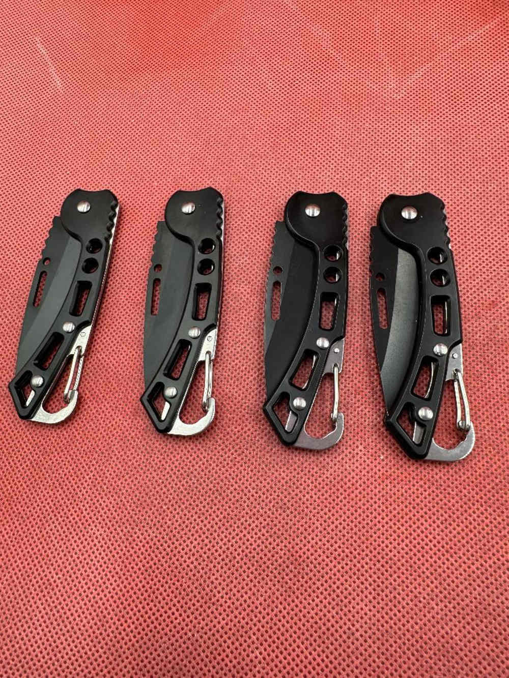 Four Black Stainless Pocket Knives -img-1