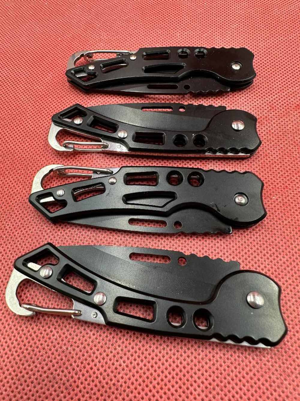 Four Black Stainless Pocket Knives -img-0