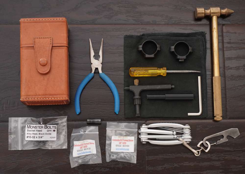 Lot of Thompson Center Tools, Scope Rings, Leather Case and Forend Screws-img-0