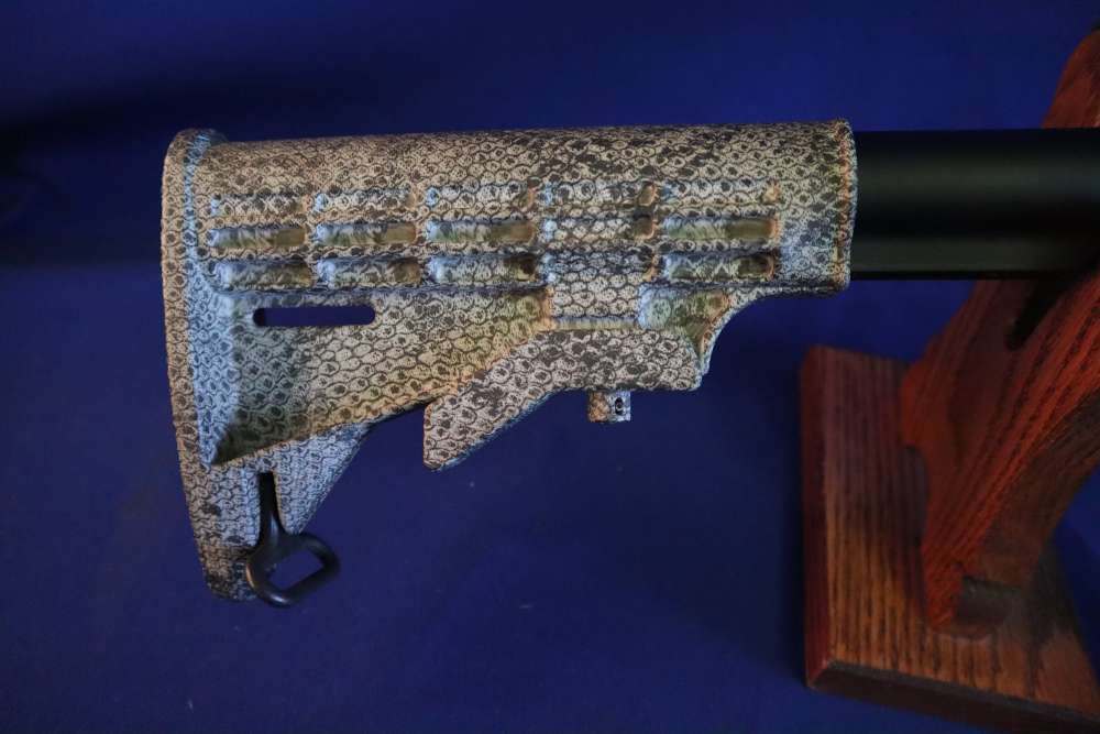 Bushmaster xm15 e2s snake skin factory finish in 98% minty condition -img-1