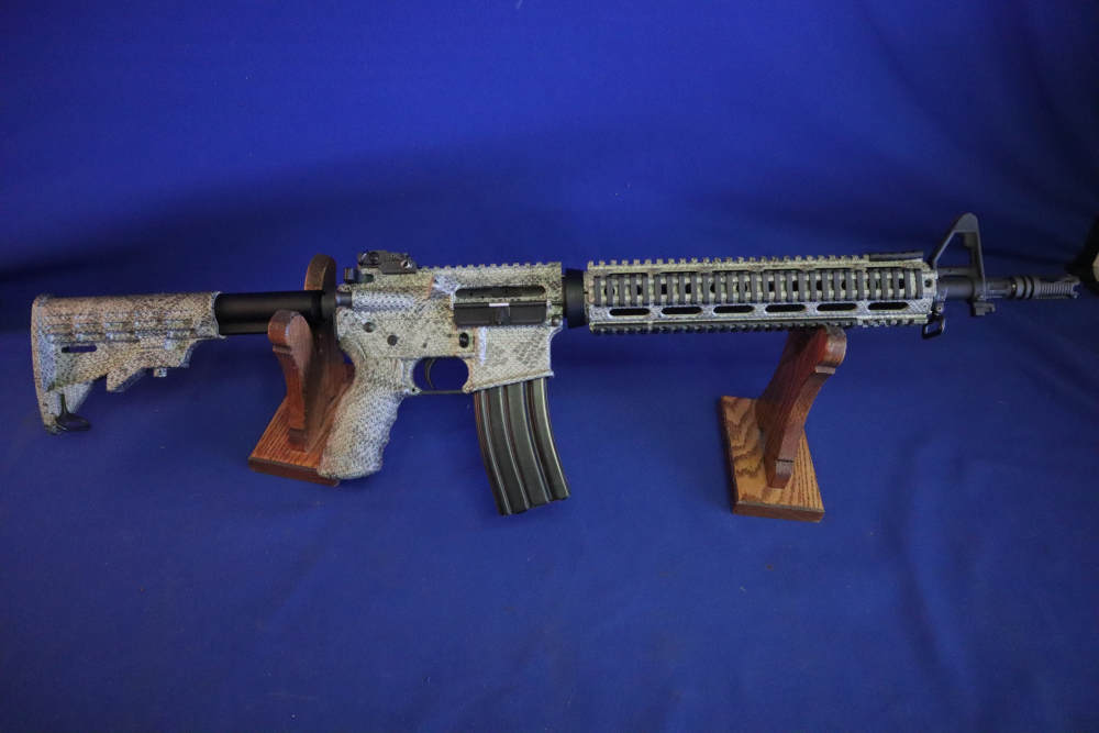 Bushmaster xm15 e2s snake skin factory finish in 98% minty condition -img-0