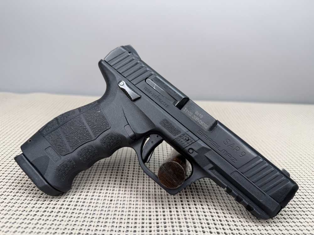 Sar Sarsilmaz SR9 with one seventeen round magazine.-img-3