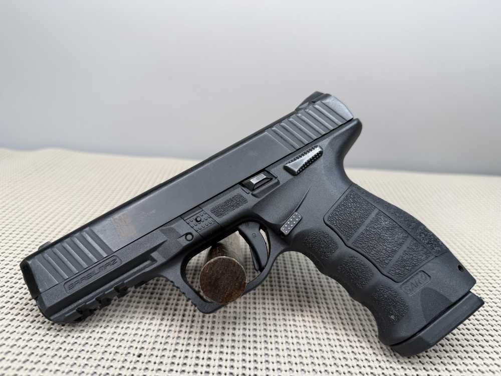 Sar Sarsilmaz SR9 with one seventeen round magazine.-img-0