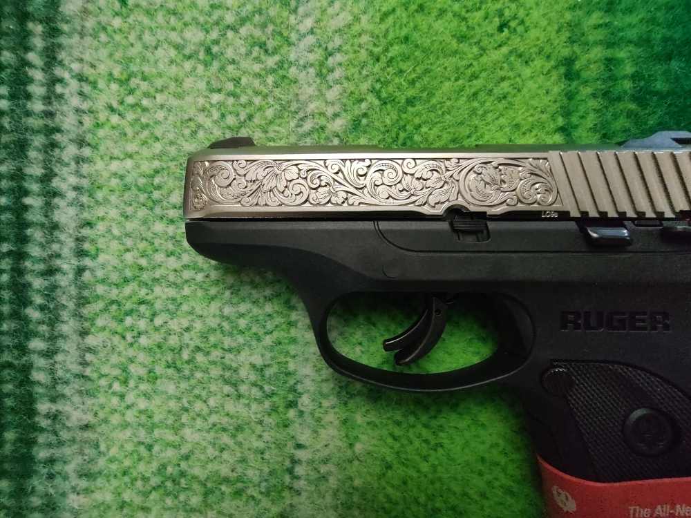 RUGER LC9s WITH NICKEL PLATED SLIDE AND FACTORY SCROLLING-img-1
