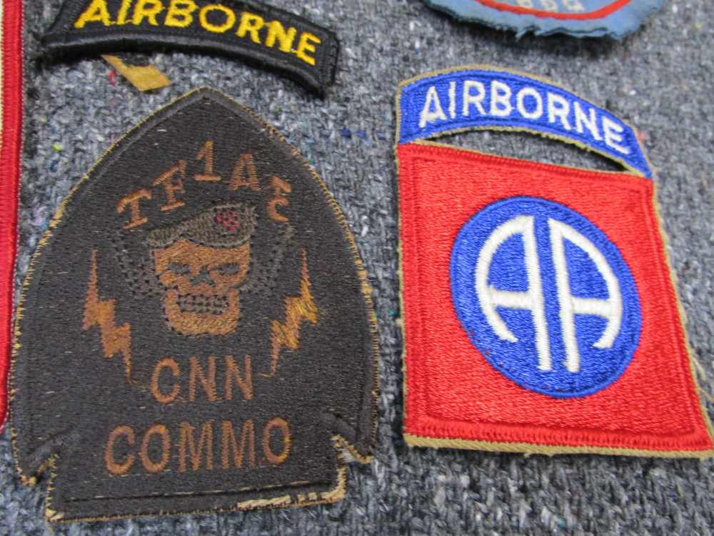 NEAT LOT OF WWII-VIETNAM WAR ERA MANUALS, PATCHES, CIGARETTES-PLAYING CARDS-img-1