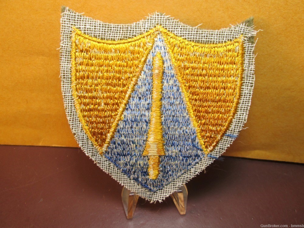 U.S. WW 2, 65th. Calvary Division unit patch on green wool-img-1