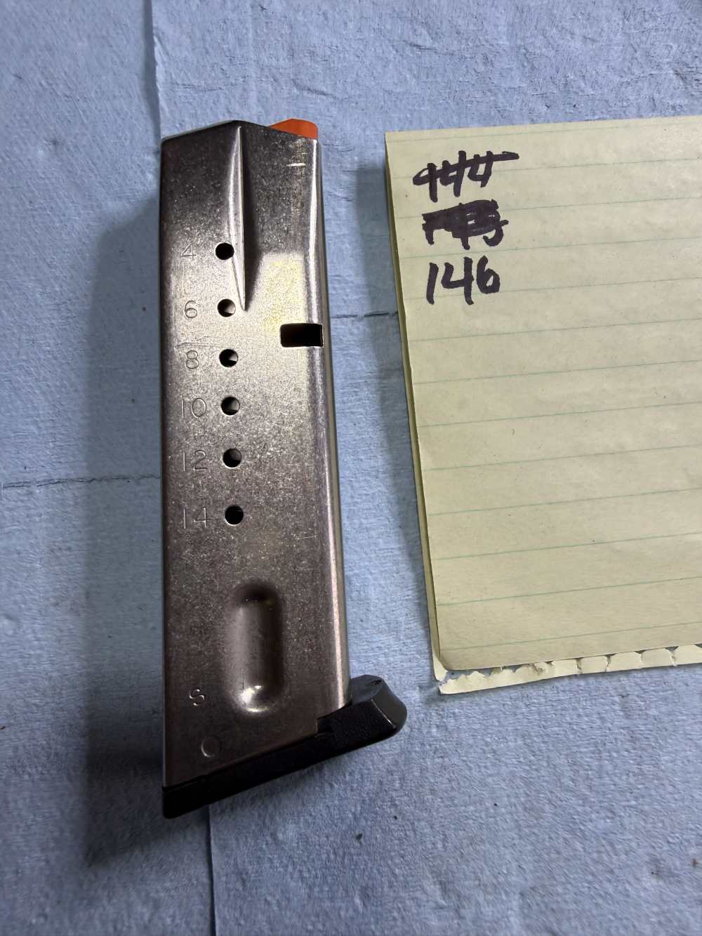 146. S&W M&P9 15rd 9mm Factory Magazine SS Orange Follower Used-img-0