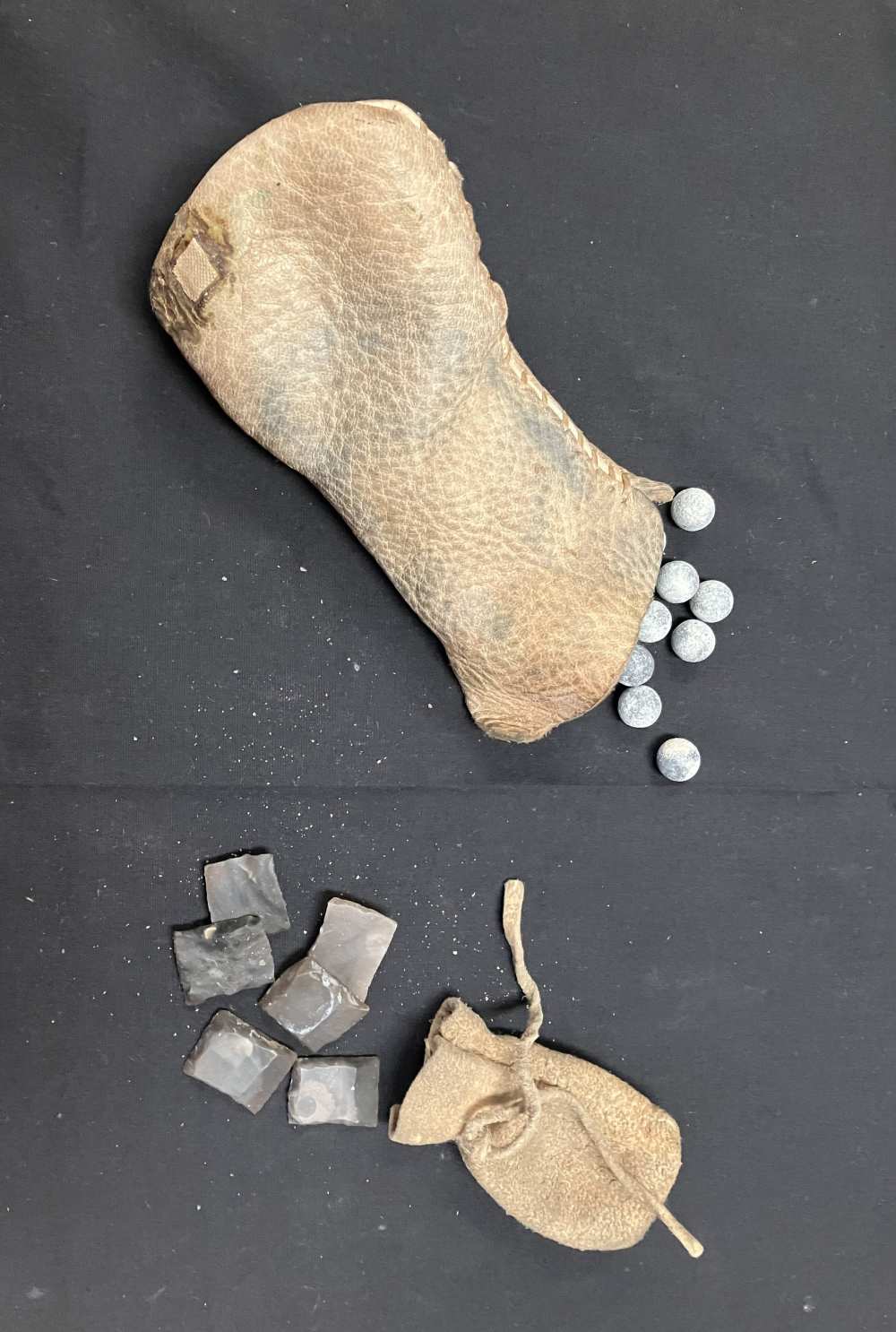 Rifle flints and .440 balls in their original buckskin pouches-img-0