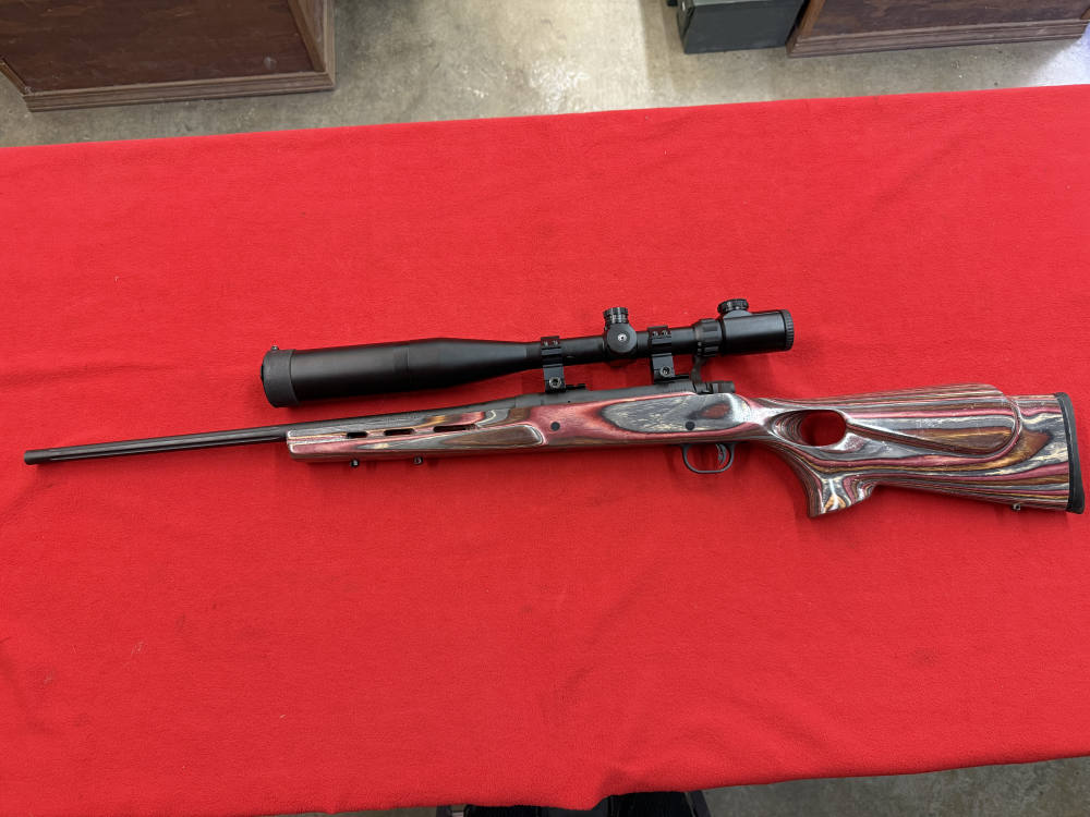 MOSSBERG 100 ATR .243 RIFLE WITH A BARSKA10x40x50  SCOPE-img-0
