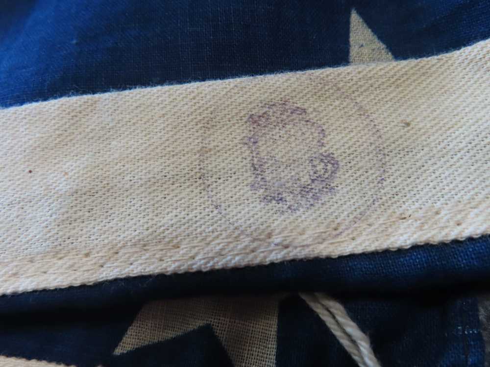 WWII 48 STAR FLAG BANNER THAT MEASURES 2' BY 10' WITH UNKNOWN MARKING-img-2
