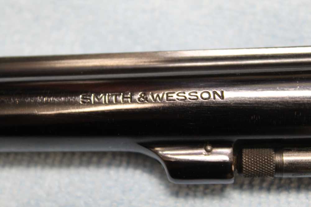Smith & Wesson Model 17-4, .22 LR 8. 3/8 barrel, blued wood grips-img-23