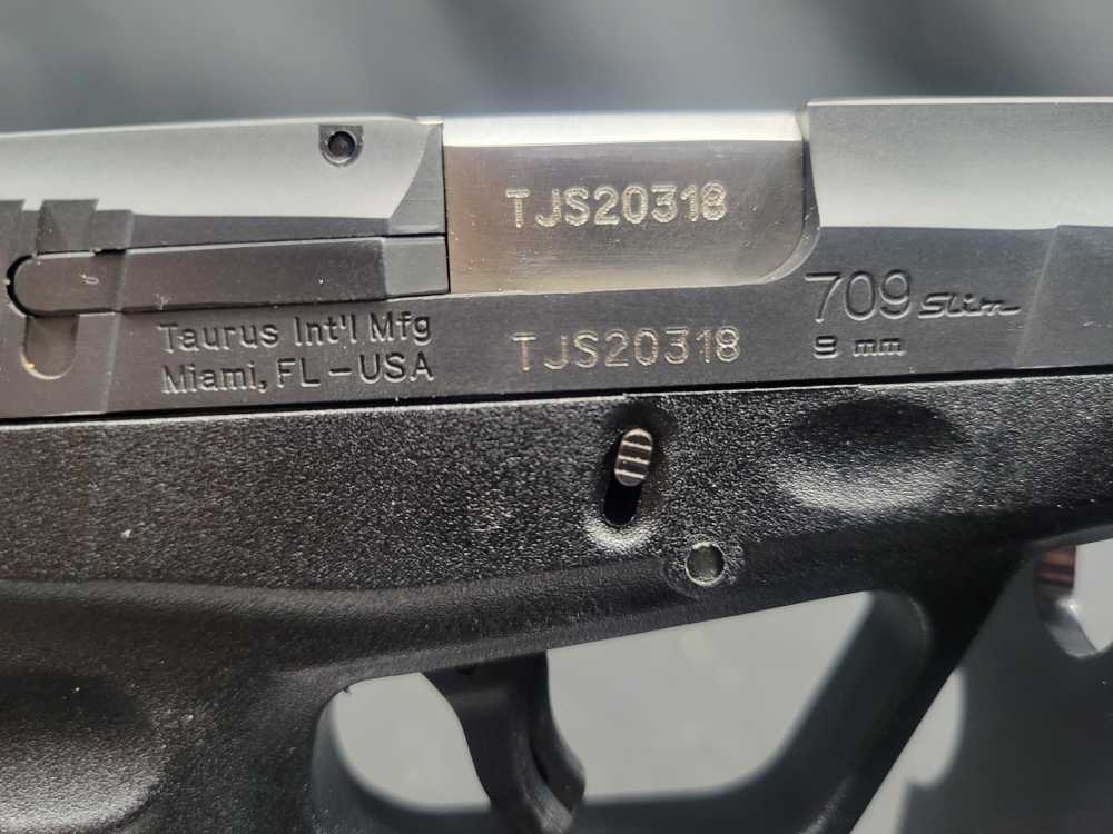 PENNY AUCTION TAURUS PT 709 SLIM 9MM 7 RDS-img-15