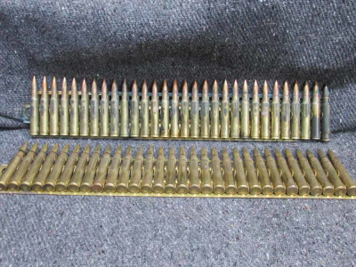 60 ROUNDS WWII JAPANESE 7.7x58mm SEMI RIMMED AMMO ON 2 BRASS MG FEED STRIPS