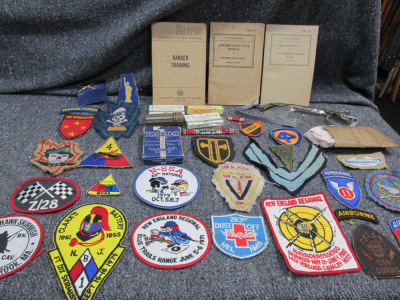 NEAT LOT OF WWII-VIETNAM WAR ERA MANUALS, PATCHES, CIGARETTES-PLAYING CARDS